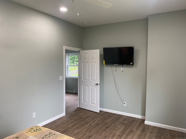 unfurnished bedroom featuring ceiling fan and hardwood / wood-style flooring