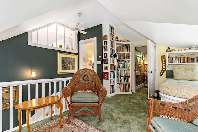 sitting room with carpet floors, baseboards, a ceiling fan, and lofted ceiling