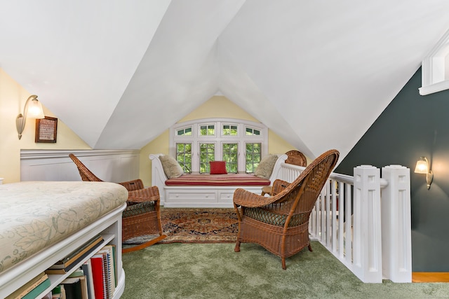 bedroom with lofted ceiling and carpet floors