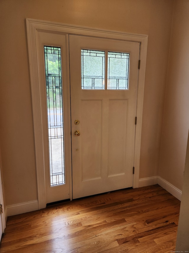 foyer with light wood-type flooring