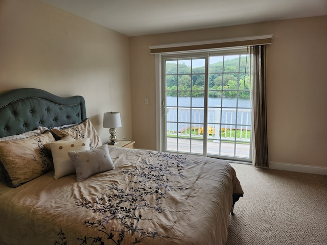 carpeted bedroom featuring access to outside