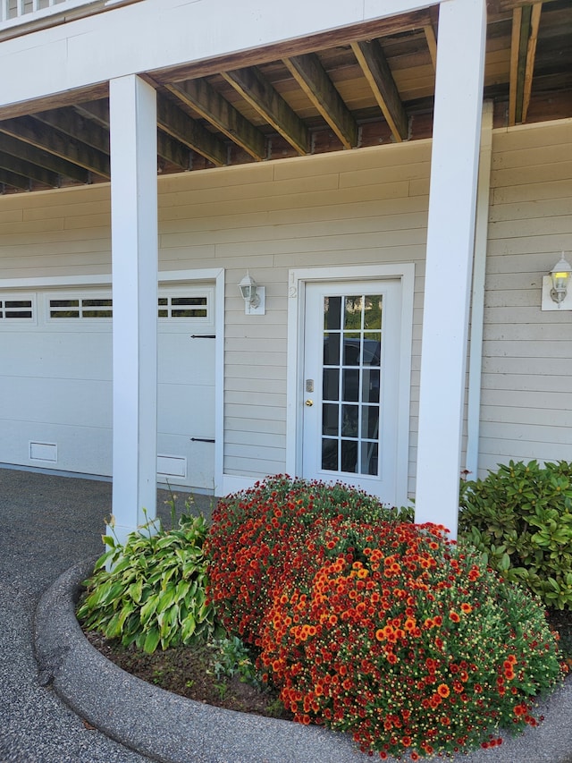 entrance to property featuring a garage