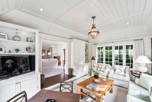 living room featuring wooden ceiling, dark hardwood / wood-style floors, and built in features