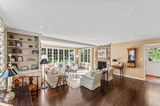 living room with a fireplace, ornamental molding, and dark hardwood / wood-style floors