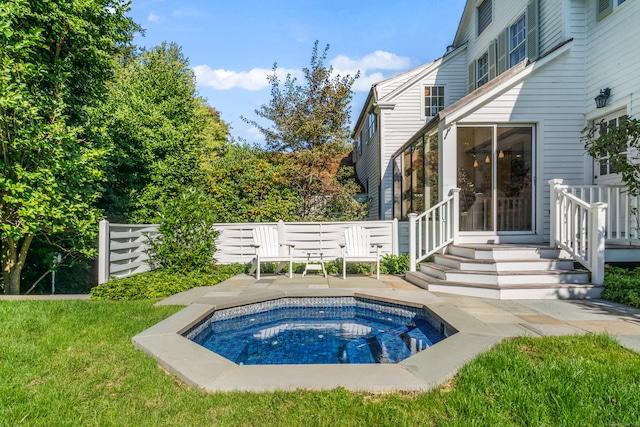 view of pool featuring a yard and a patio area