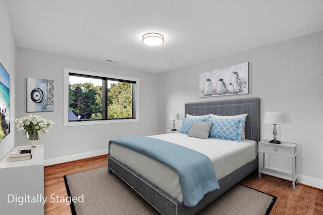 bedroom featuring hardwood / wood-style floors