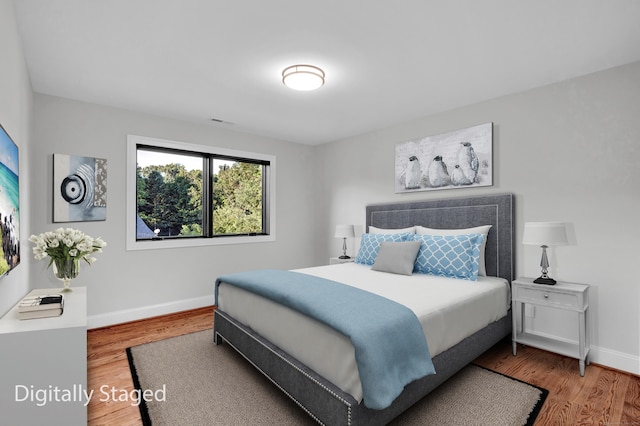 bedroom featuring hardwood / wood-style flooring