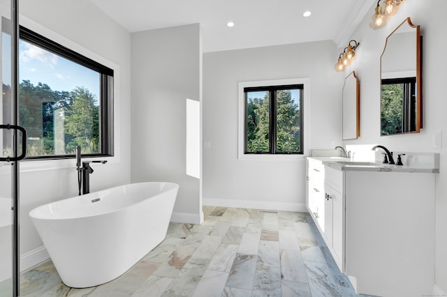 bathroom with dual vanity, tile patterned flooring, and a bath