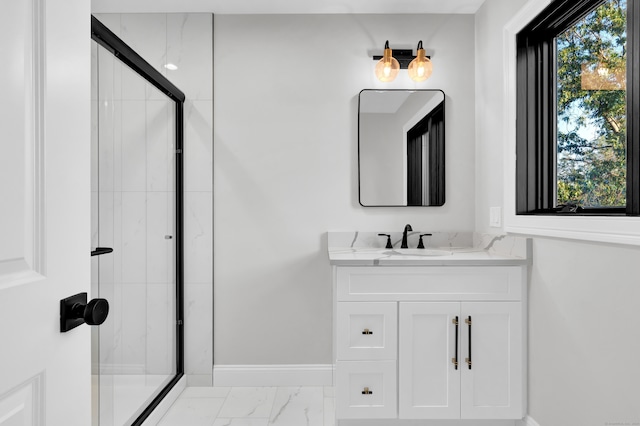 bathroom with walk in shower, vanity, and tile patterned flooring