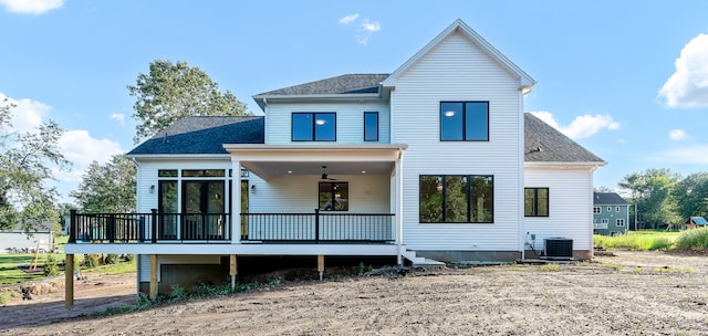 rear view of property with central AC and a deck