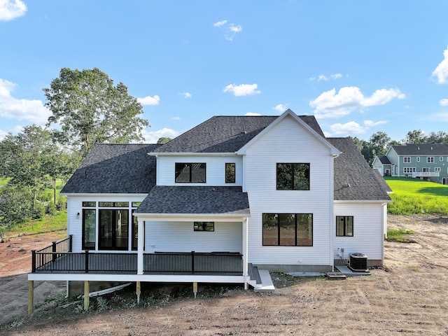 back of property with cooling unit and a deck