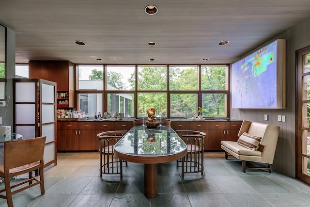 dining room with a wealth of natural light and wood ceiling