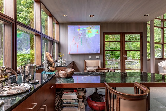 sunroom featuring wooden ceiling