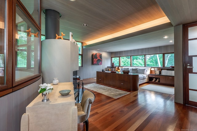 dining room featuring wooden ceiling and dark wood-type flooring