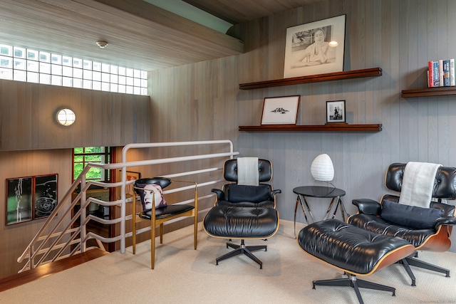 sitting room featuring wood walls