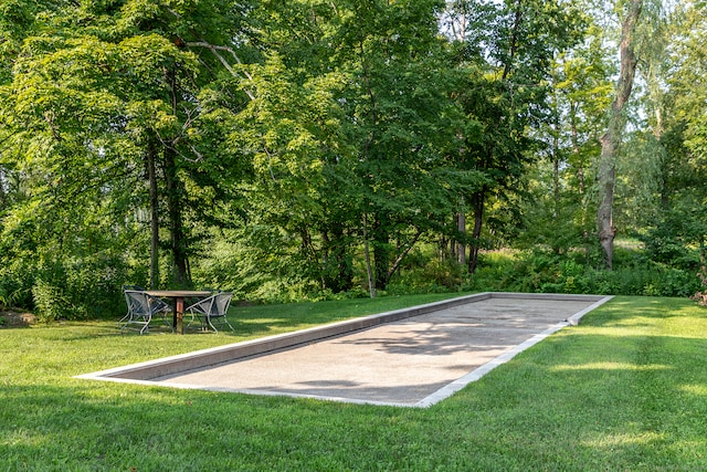 view of home's community with a lawn