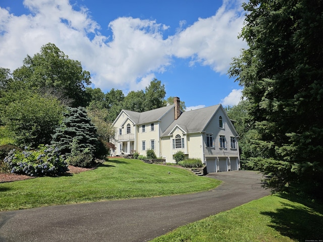 view of front of house featuring a garage and a front yard