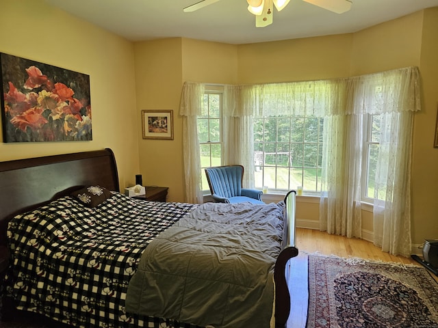 bedroom featuring ceiling fan and light hardwood / wood-style flooring