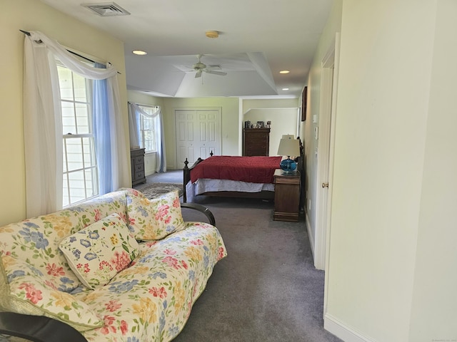 carpeted bedroom with a closet and ceiling fan