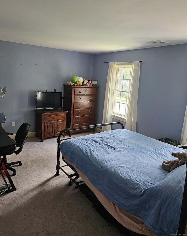 bedroom with light carpet