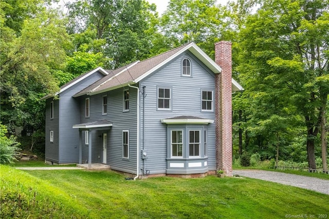 back of house with a yard