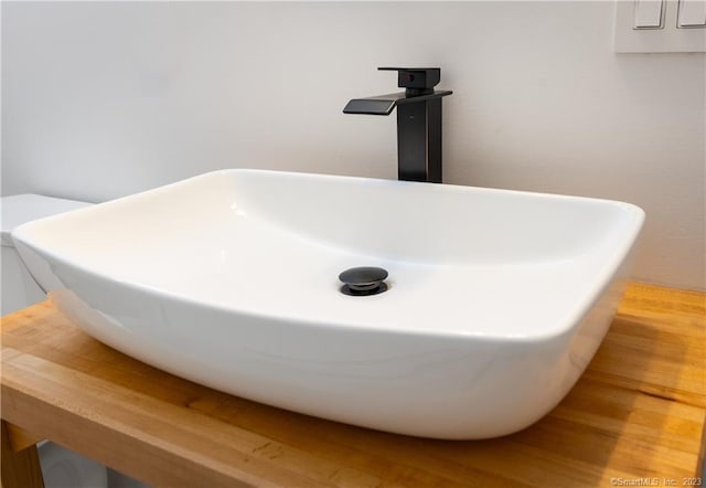 details featuring wood-type flooring and sink