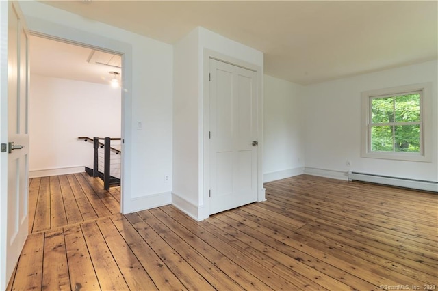 unfurnished room with light wood-type flooring