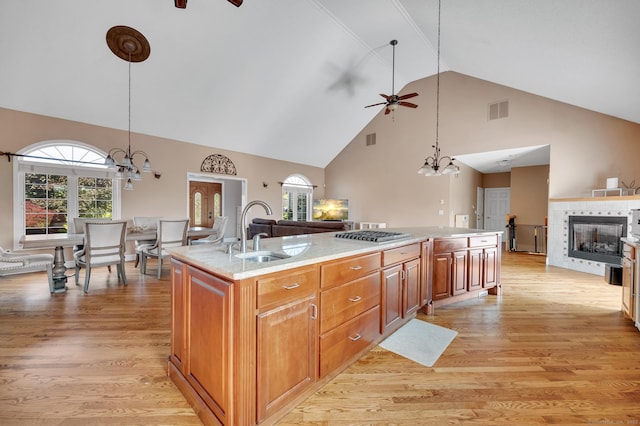15 Huntington Ridge Rd, Wallingford, CT 06492 - kitchen featuring ceiling fan, high vaulted ceiling, a sink, open floor plan, and light wood-type flooring