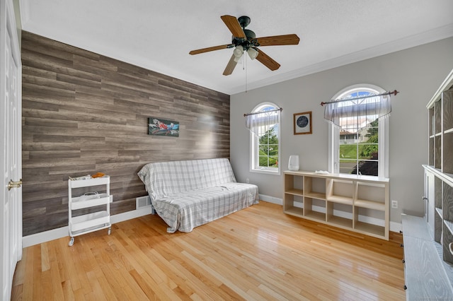 15 Huntington Ridge Rd, Wallingford, CT 06492 - sitting room featuring an accent wall, a ceiling fan, wood finished floors, crown molding, and baseboards