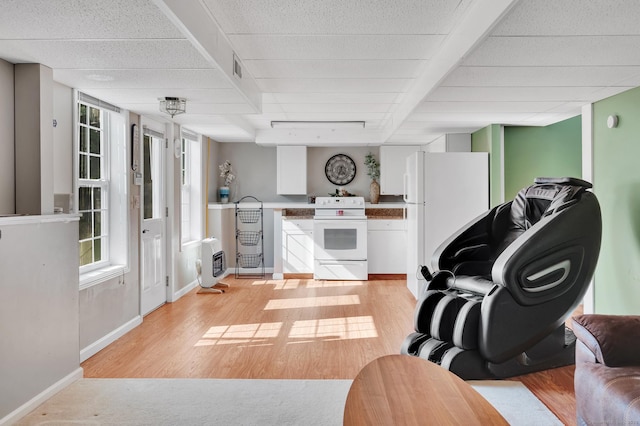 15 Huntington Ridge Rd, Wallingford, CT 06492 - living room featuring healthy amount of natural light, light wood-type flooring, and baseboards