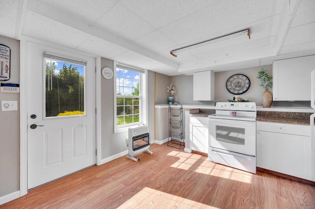 15 Huntington Ridge Rd, Wallingford, CT 06492 - kitchen with electric range, heating unit, light wood-type flooring, white cabinetry, and baseboards