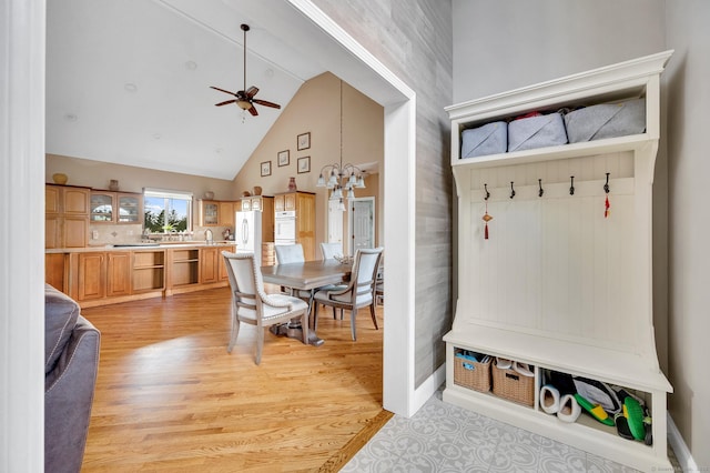 15 Huntington Ridge Rd, Wallingford, CT 06492 - mudroom featuring high vaulted ceiling, a ceiling fan, light wood finished floors, a chandelier, and baseboards