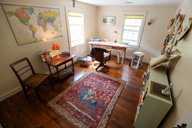 home office with hardwood / wood-style flooring