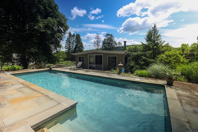 view of swimming pool featuring a patio area