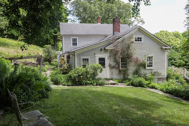 view of side of home featuring a lawn