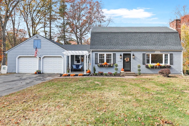 view of front facade with a front yard and a garage