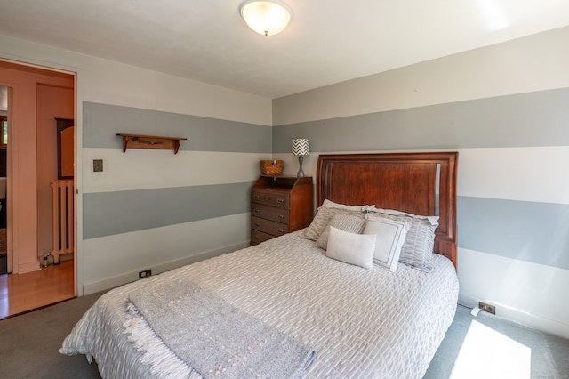 carpeted bedroom with radiator heating unit