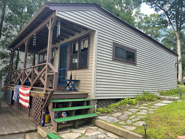 view of property exterior with a porch