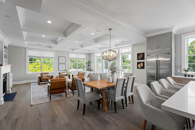 dining area with coffered ceiling, hardwood / wood-style floors, and a wealth of natural light