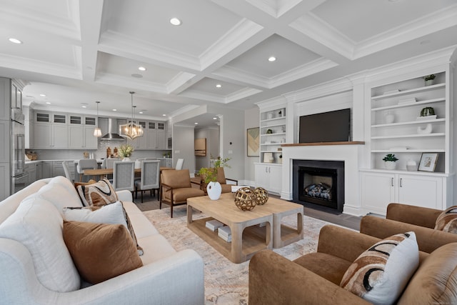 living room featuring built in features, coffered ceiling, light hardwood / wood-style floors, beamed ceiling, and ornamental molding