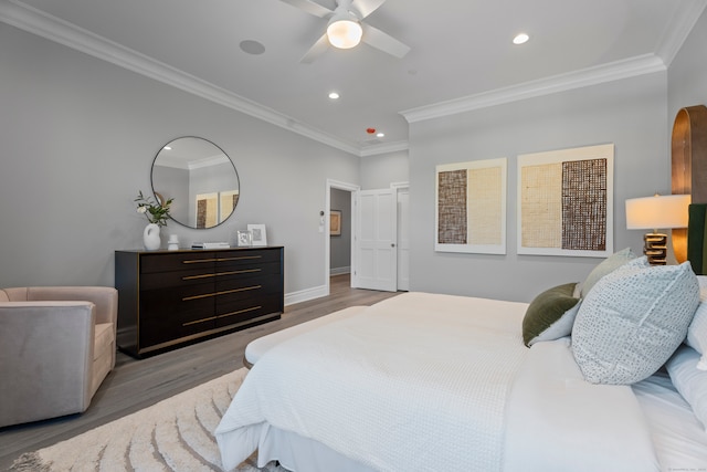 bedroom with ceiling fan, crown molding, and light hardwood / wood-style floors