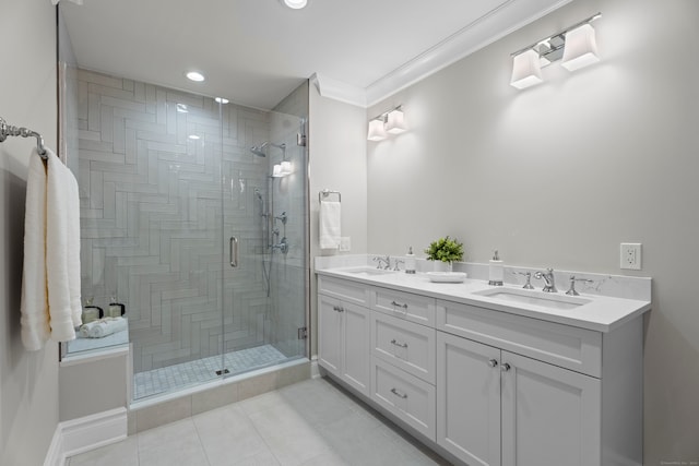 bathroom with crown molding, walk in shower, tile patterned floors, and dual bowl vanity