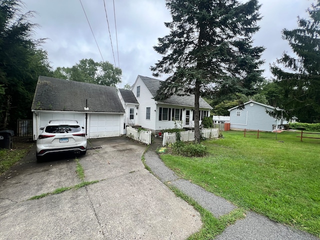 view of front facade with a front yard and a garage