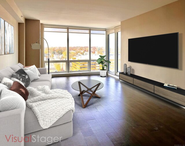 living room featuring expansive windows, a healthy amount of sunlight, and hardwood / wood-style flooring