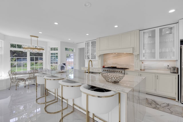 kitchen featuring plenty of natural light, a breakfast bar area, and tasteful backsplash