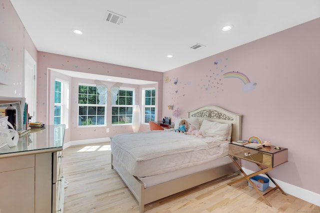 bedroom with light hardwood / wood-style floors