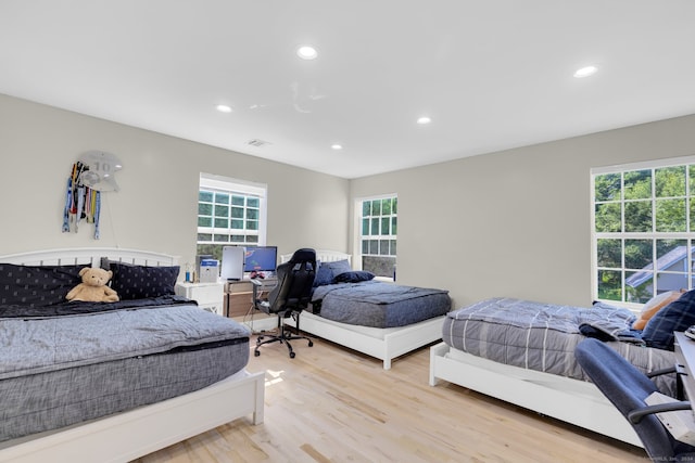 bedroom with light wood-type flooring