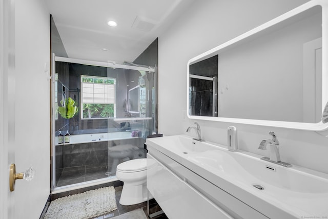 full bathroom featuring vanity, toilet, and independent shower and bath