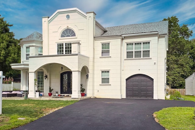 view of front facade with a garage and a front yard