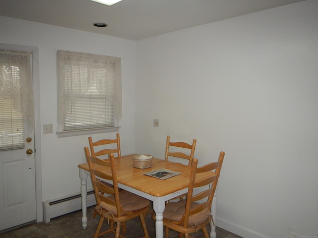 dining space with baseboard heating